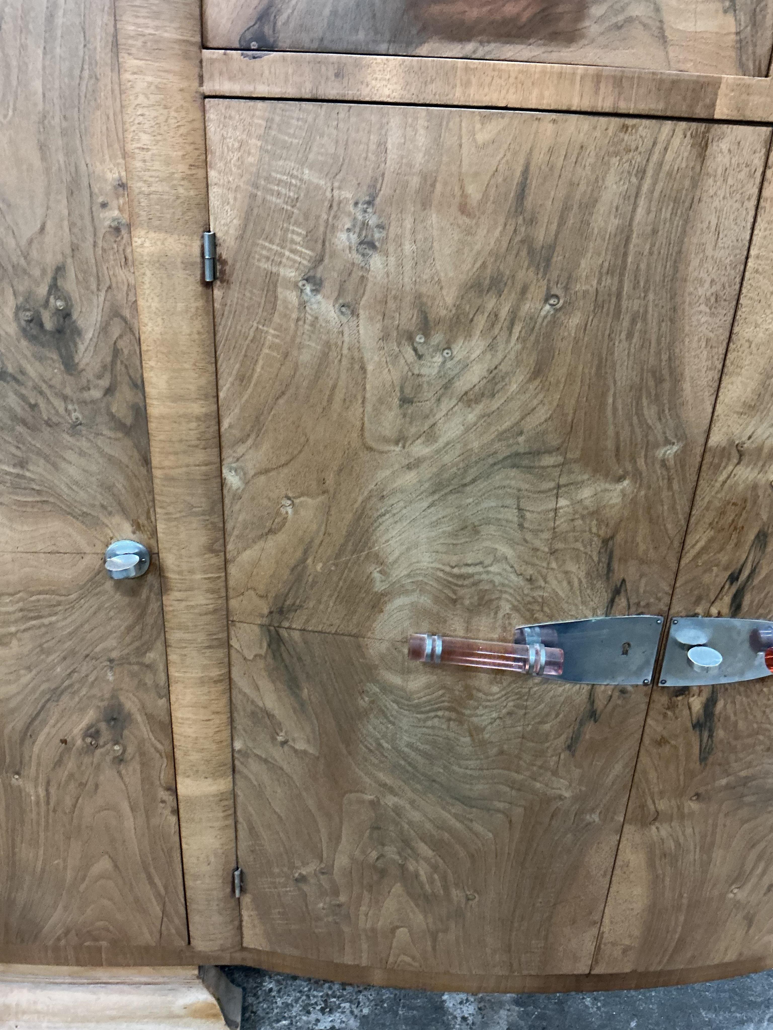 An Art Deco walnut marble topped bow front sideboard, width 158cm, depth 50cm, height 110cm